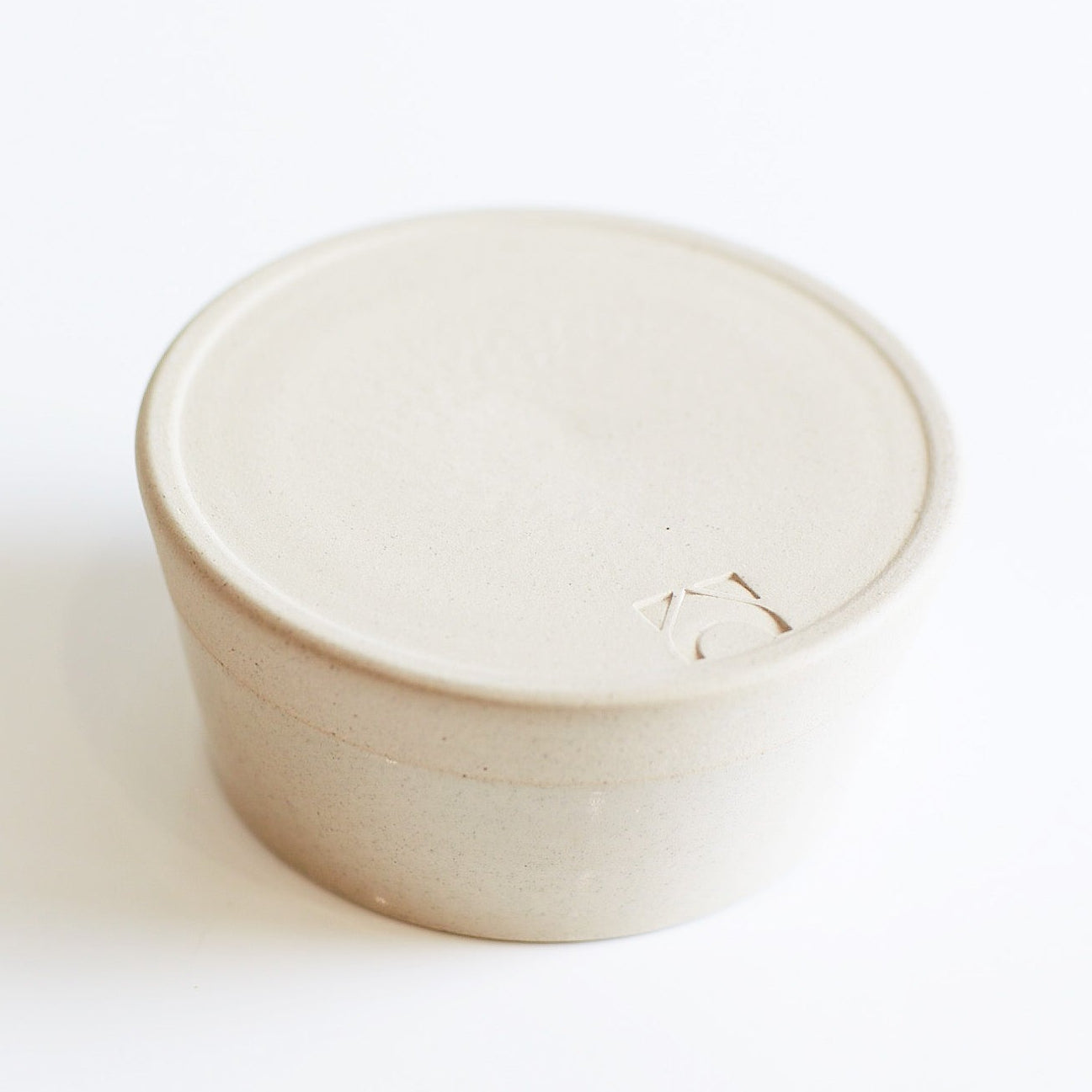 logo detail on base of bowl against a white background