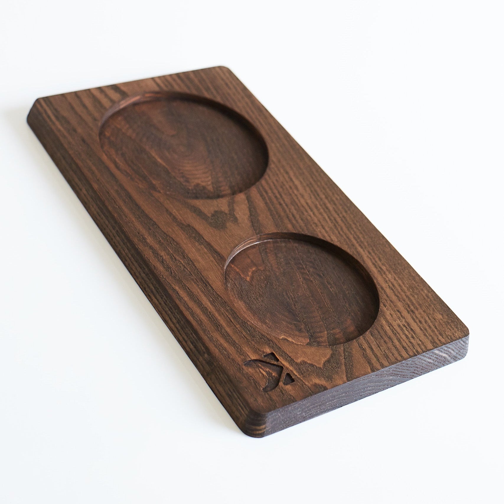 Dark wooden tray on a white background
