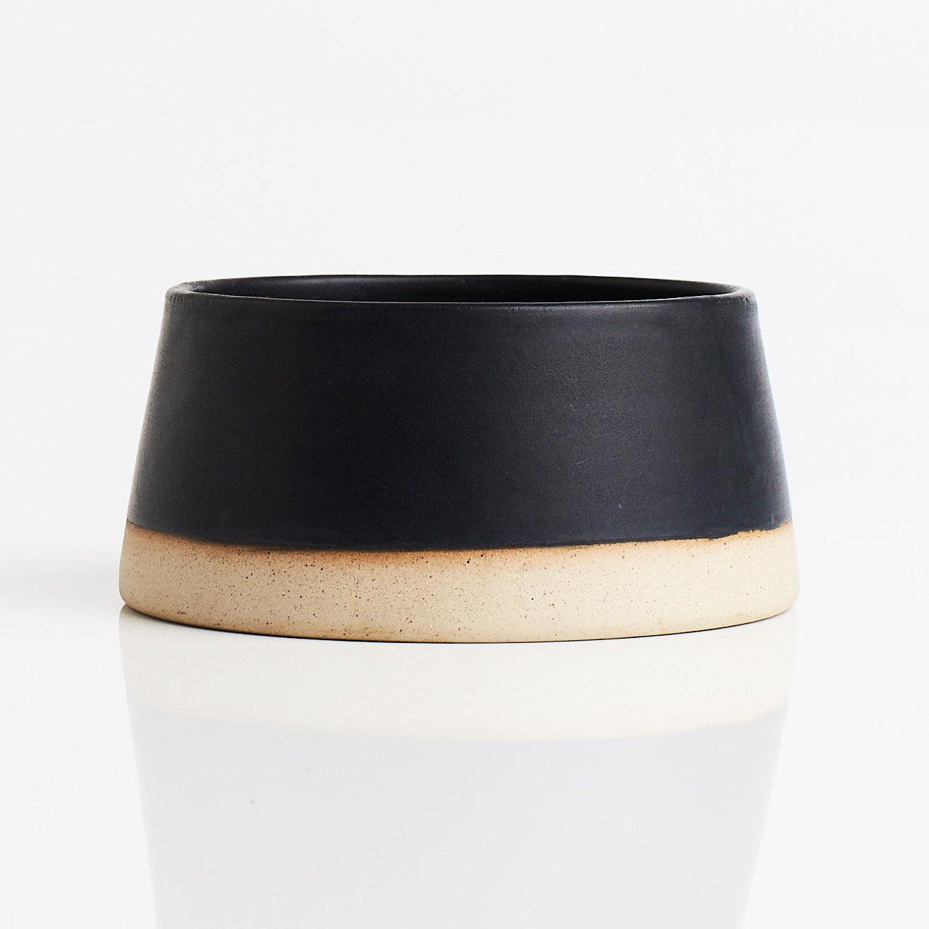 Black dog water bowl on a white background

