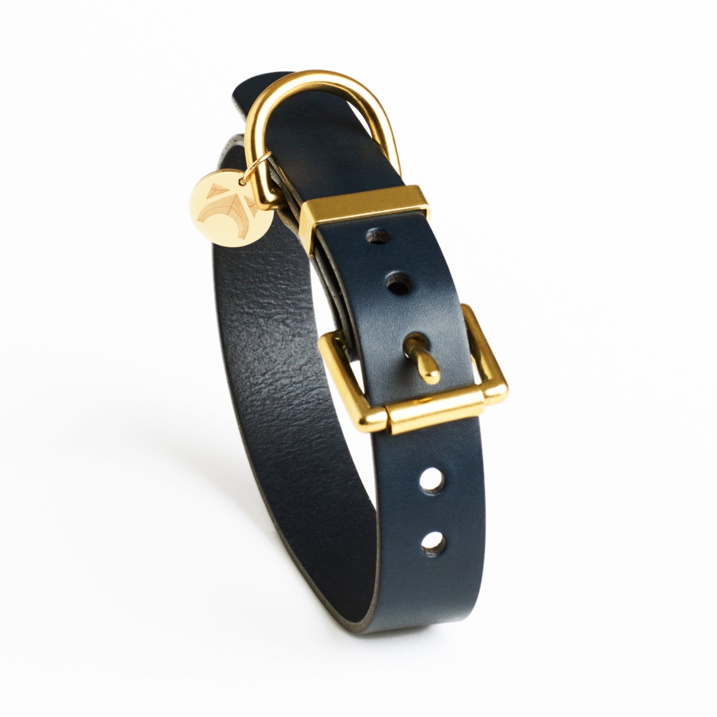Midnight blue plain leather dog collar with brass buckle on a white background